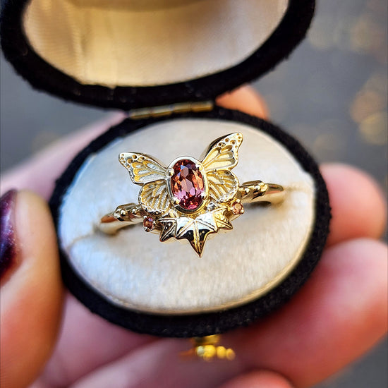 rose champagne oval garnet butterfly ring with 3 ivy leaves and orange sapphires 