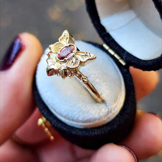 rose champagne oval garnet butterfly ring with 3 ivy leaves and orange sapphires 