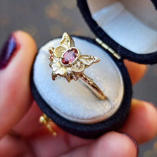 rose champagne oval garnet butterfly ring with 3 ivy leaves and orange sapphires 