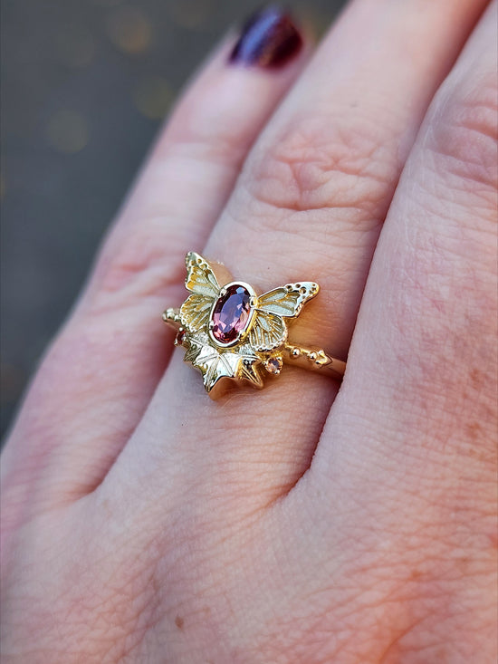 rose champagne oval garnet butterfly ring with 3 ivy leaves and orange sapphires 