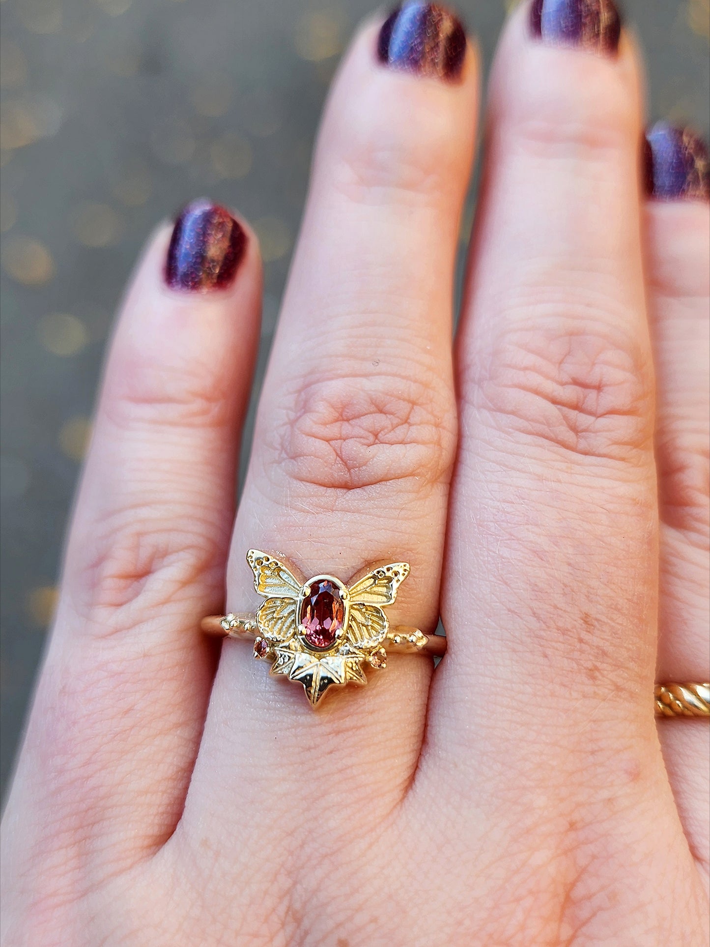 rose champagne oval garnet butterfly ring with 3 ivy leaves and orange sapphires 