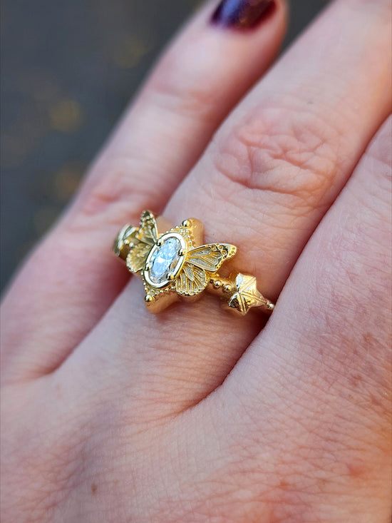 oval lab diamond butterfly ring 14k yellow gold by swankmetalsmithing