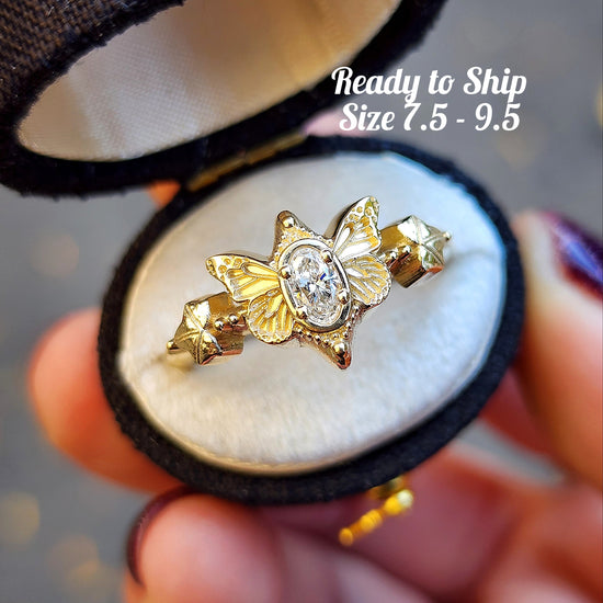 oval lab diamond butterfly ring 14k yellow gold by swankmetalsmithing