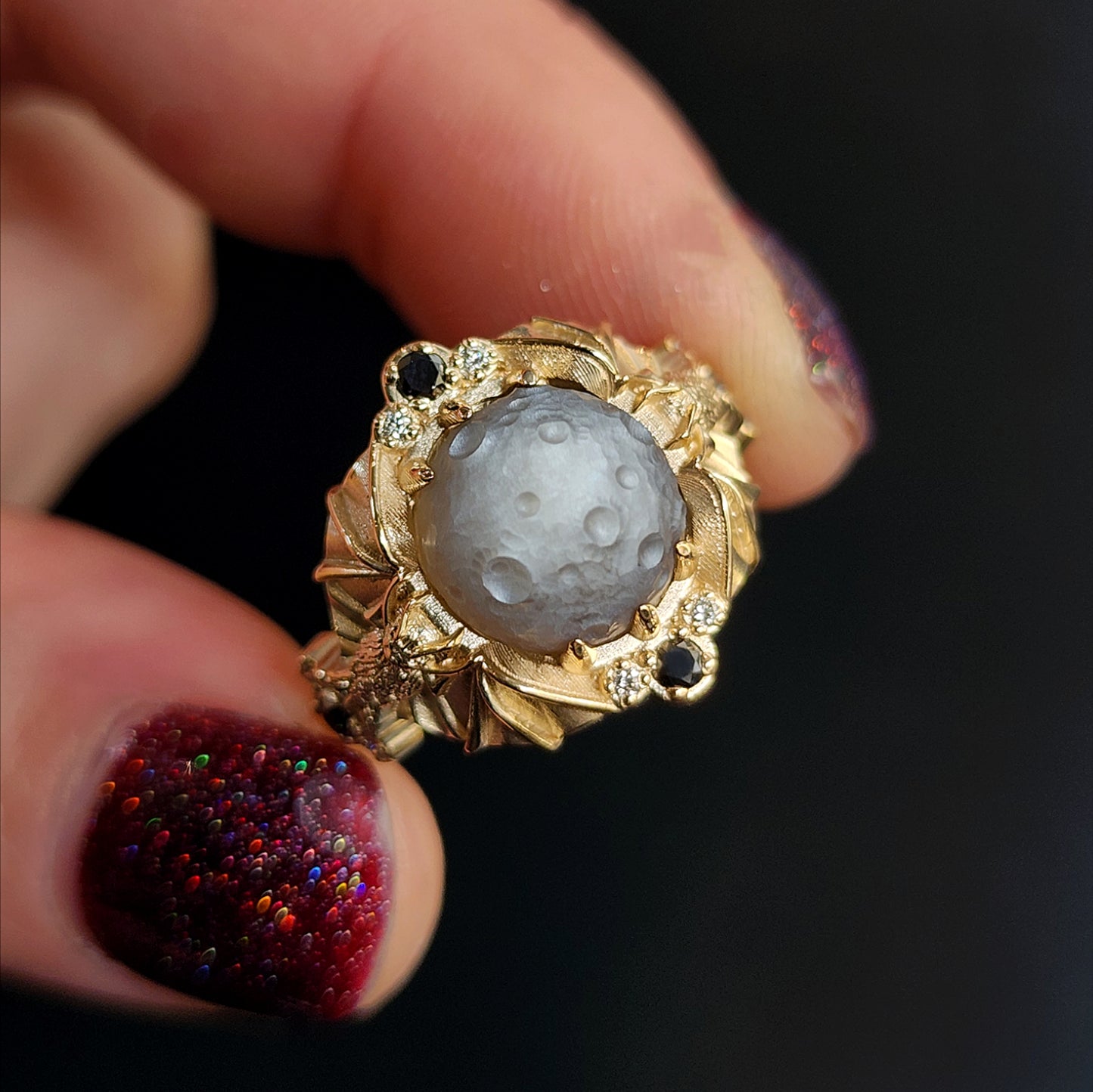 Keepers of the Moon ring by SwankMetalsmithing with hand carved gray moonstone moon and gold vampire bats