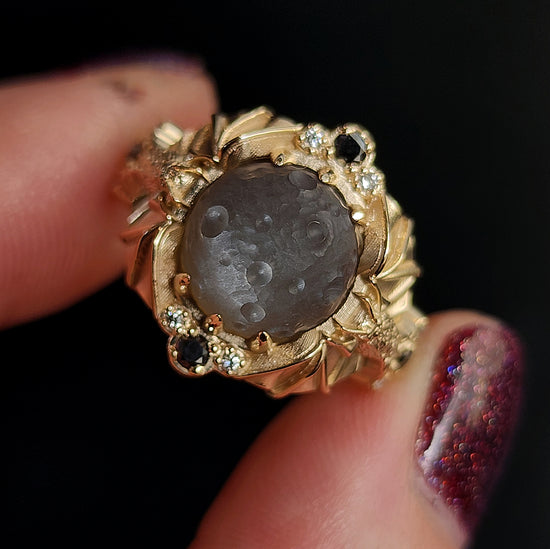 Keepers of the Moon ring by SwankMetalsmithing with hand carved gray moonstone moon and gold vampire bats