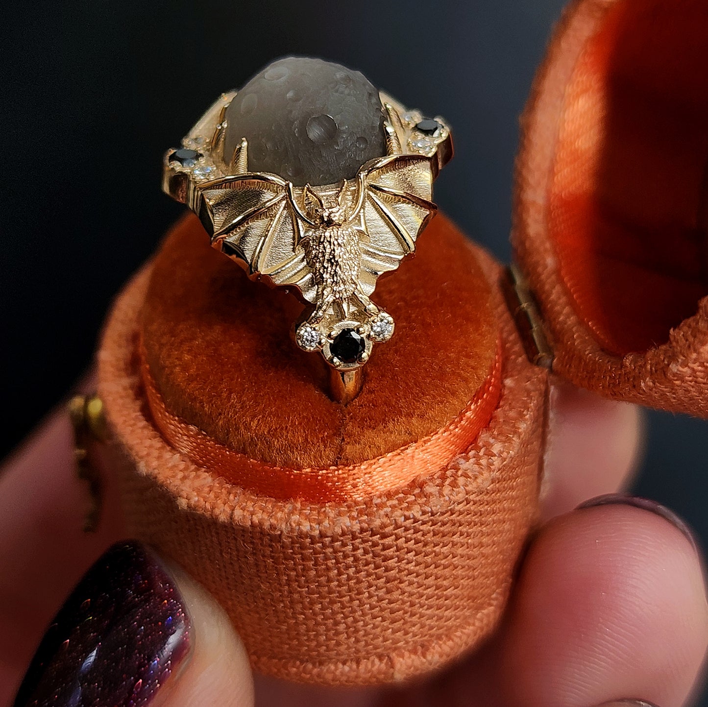 Keeper of the Moon ring by SwankMetalsmithing with hand carved gray moonstone moon and gold vampire bats