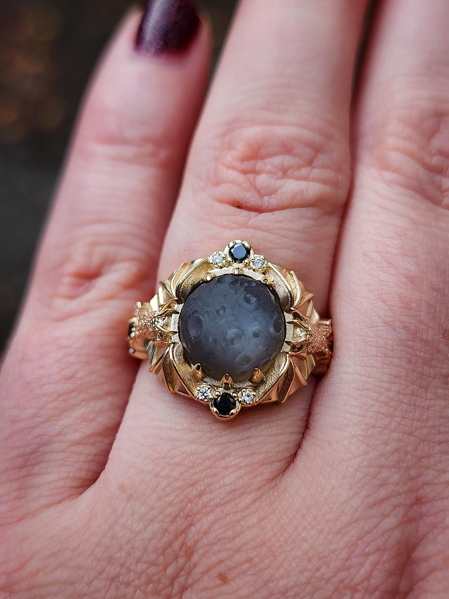 Keeper of the Moon ring by SwankMetalsmithing with hand carved gray moonstone moon and gold vampire bats