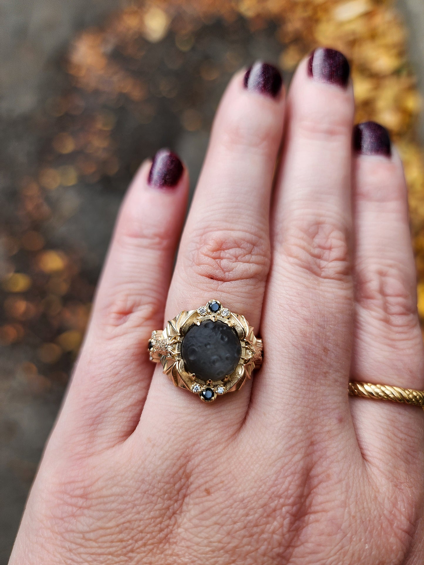 Keeper of the Moon ring by SwankMetalsmithing with hand carved gray moonstone moon and gold vampire bats