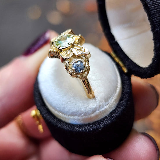 3 stone ring with Merelani mint garnet and blue sapphires with gold butterfly wings and leaves nature engagement anniversary gift