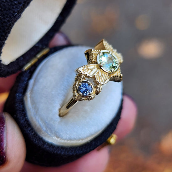 3 stone ring with Merelani mint garnet and blue sapphires with gold butterfly wings and leaves nature engagement anniversary gift