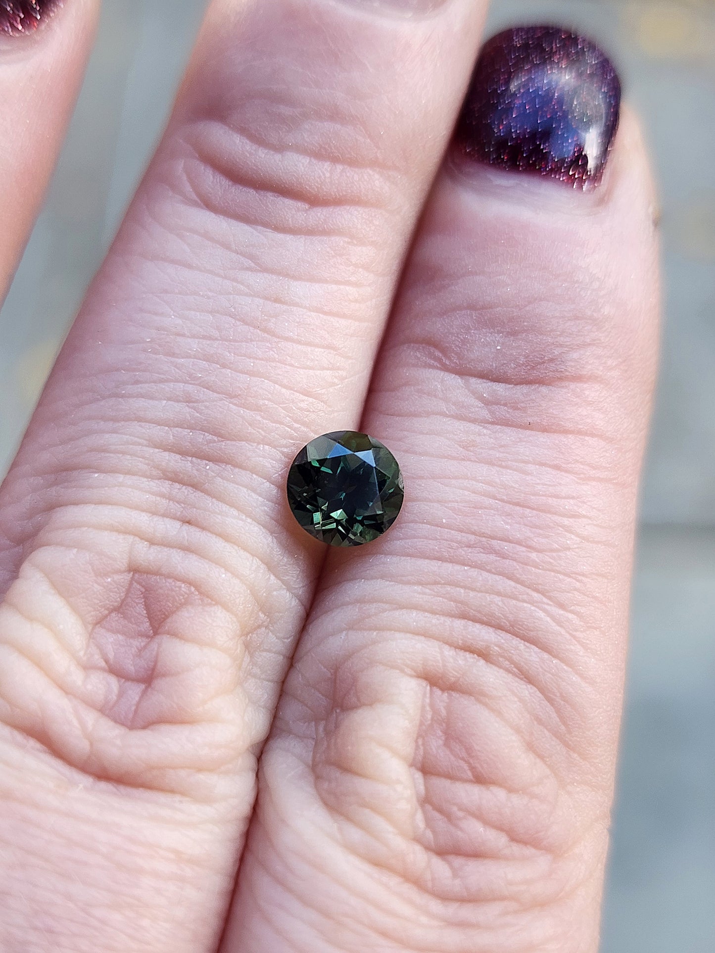 1.13ct forest green australian sapphire round brilliant 