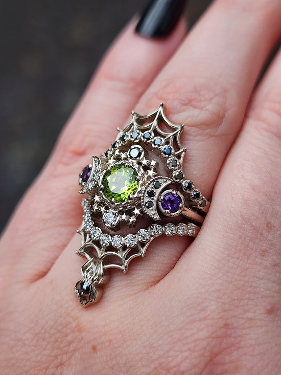 peridot and amethyst cosmos ring with black and white diamond spider web wedding bands goth pop culture wedding ring