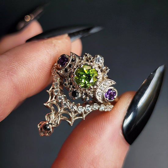 peridot and amethyst cosmos ring with black and white diamond spider web wedding bands goth pop culture wedding ring