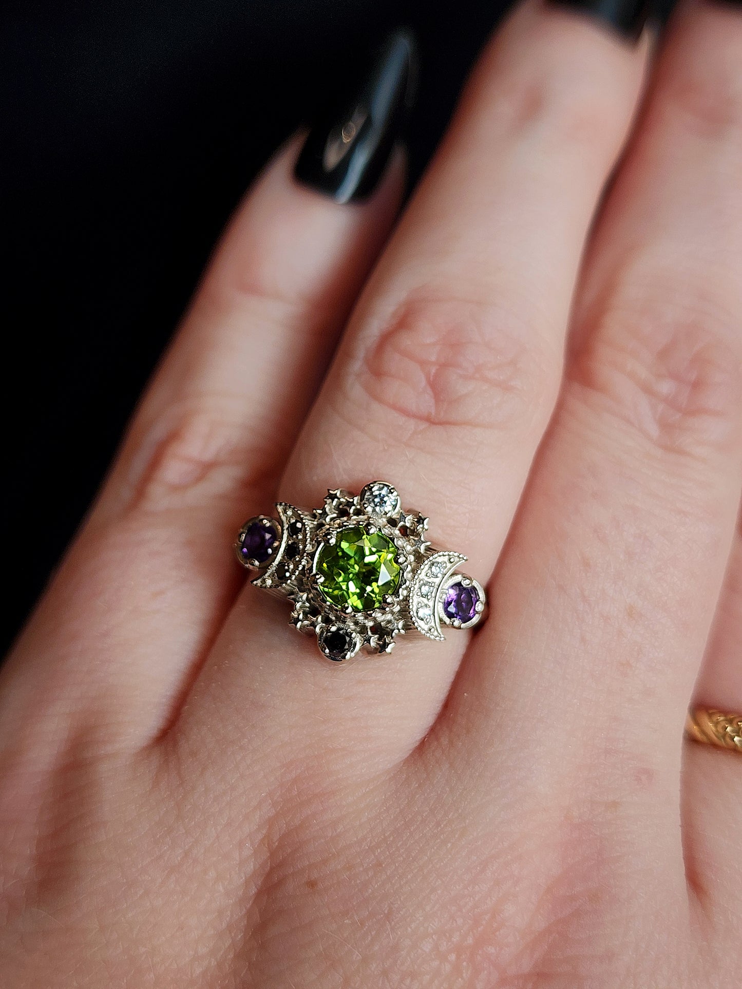 peridot and amethyst cosmos ring with black and white diamond spider web wedding bands goth pop culture wedding ring