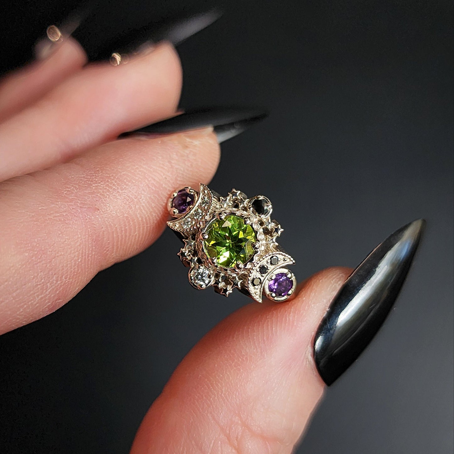 peridot and amethyst cosmos ring with black and white diamond spider web wedding bands goth pop culture wedding ring