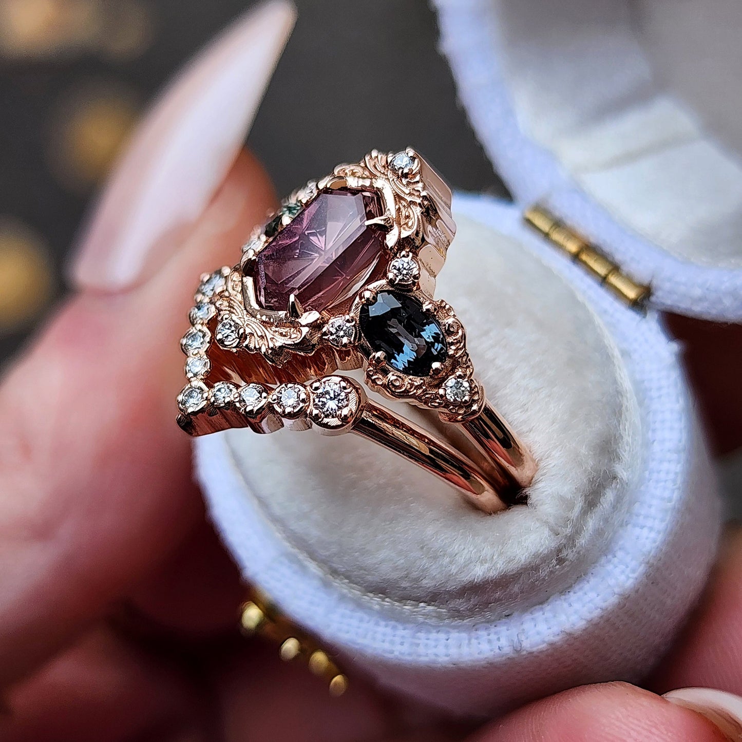 14k rose gold starbrite cut peach umba sapphire hexagon josephine engagement ring with blue sapphire ovals and diamond accents with diamond chevron wedding band fantasy ethereal wedding ring set by swankmetalsmithing