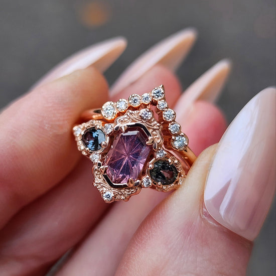 14k rose gold starbrite cut peach umba sapphire hexagon josephine engagement ring with blue sapphire ovals and diamond accents with diamond chevron wedding band fantasy ethereal wedding ring set by swankmetalsmithing