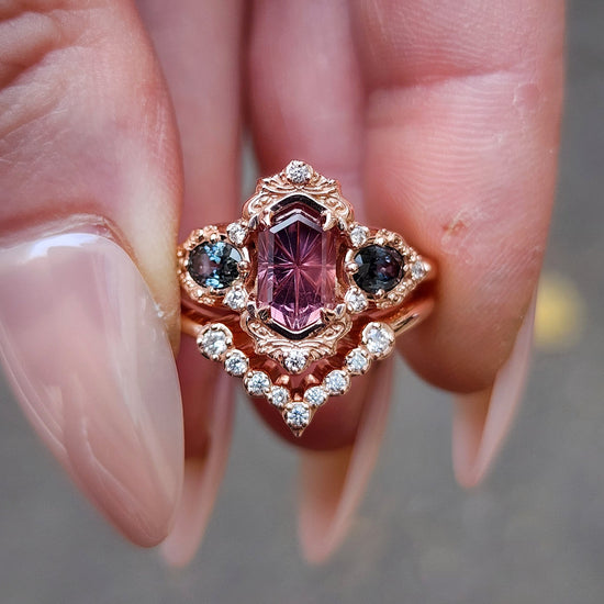 14k rose gold starbrite cut peach umba sapphire hexagon josephine engagement ring with blue sapphire ovals and diamond accents with diamond chevron wedding band fantasy ethereal wedding ring set by swankmetalsmithing