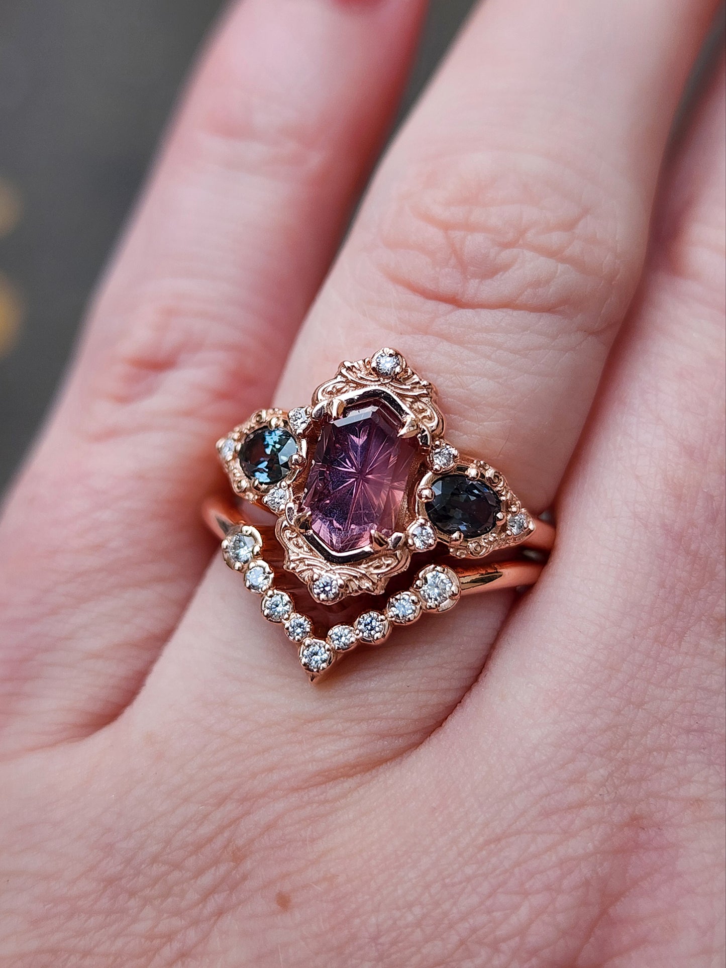 14k rose gold starbrite cut peach umba sapphire hexagon josephine engagement ring with blue sapphire ovals and diamond accents with diamond chevron wedding band fantasy ethereal wedding ring set by swankmetalsmithing