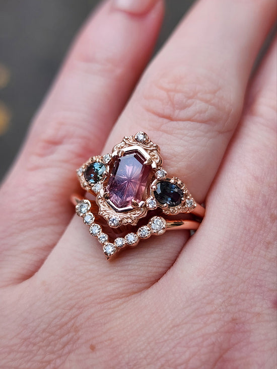 14k rose gold starbrite cut peach umba sapphire hexagon josephine engagement ring with blue sapphire ovals and diamond accents with diamond chevron wedding band fantasy ethereal wedding ring set by swankmetalsmithing