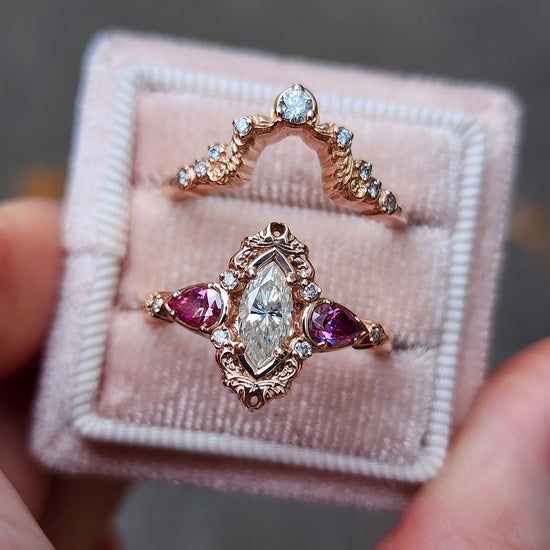 elvish marquise engagement ring with gold details and pink moissanite pears and curved diamond wedding band custom engagement ring set fantasy fairytale jewelry 