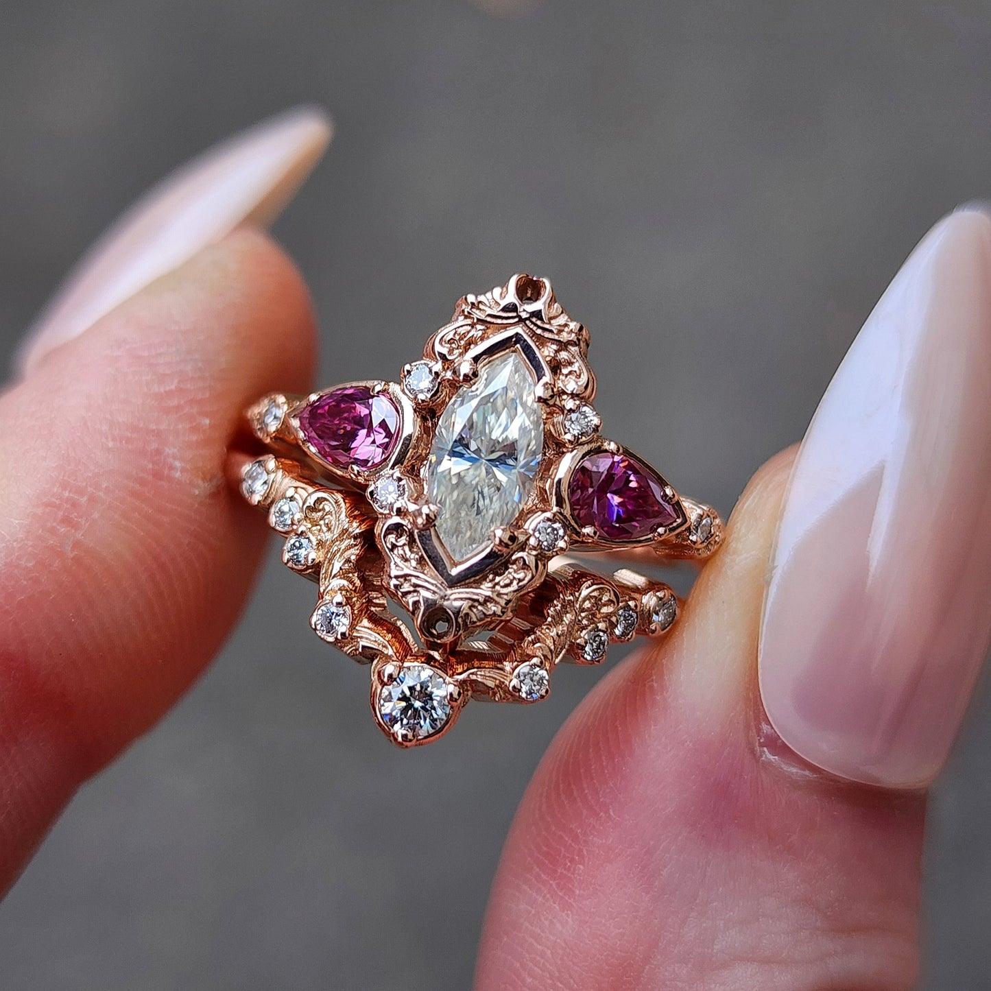 elvish marquise engagement ring with gold details and pink moissanite pears and curved diamond wedding band custom engagement ring set fantasy fairytale jewelry 