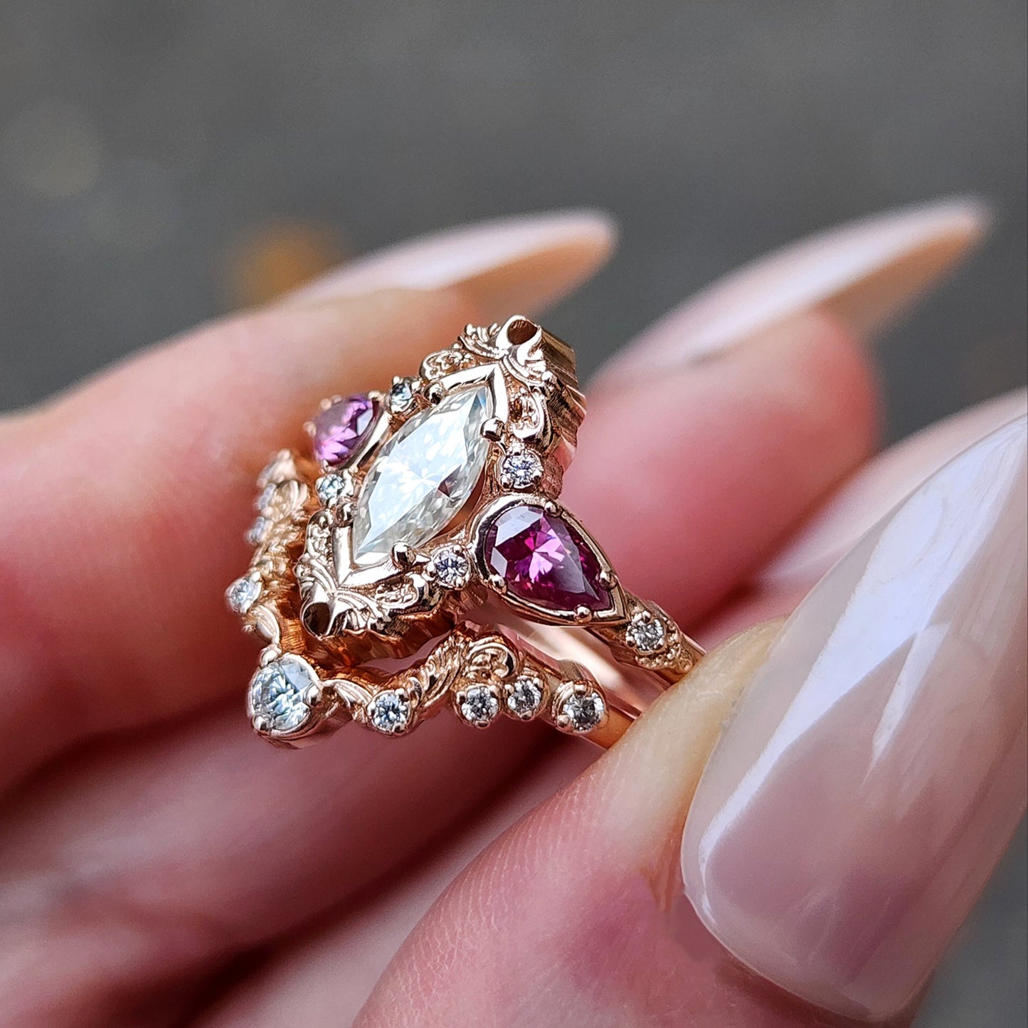 elvish marquise engagement ring with gold details and pink moissanite pears and curved diamond wedding band custom engagement ring set fantasy fairytale jewelry 