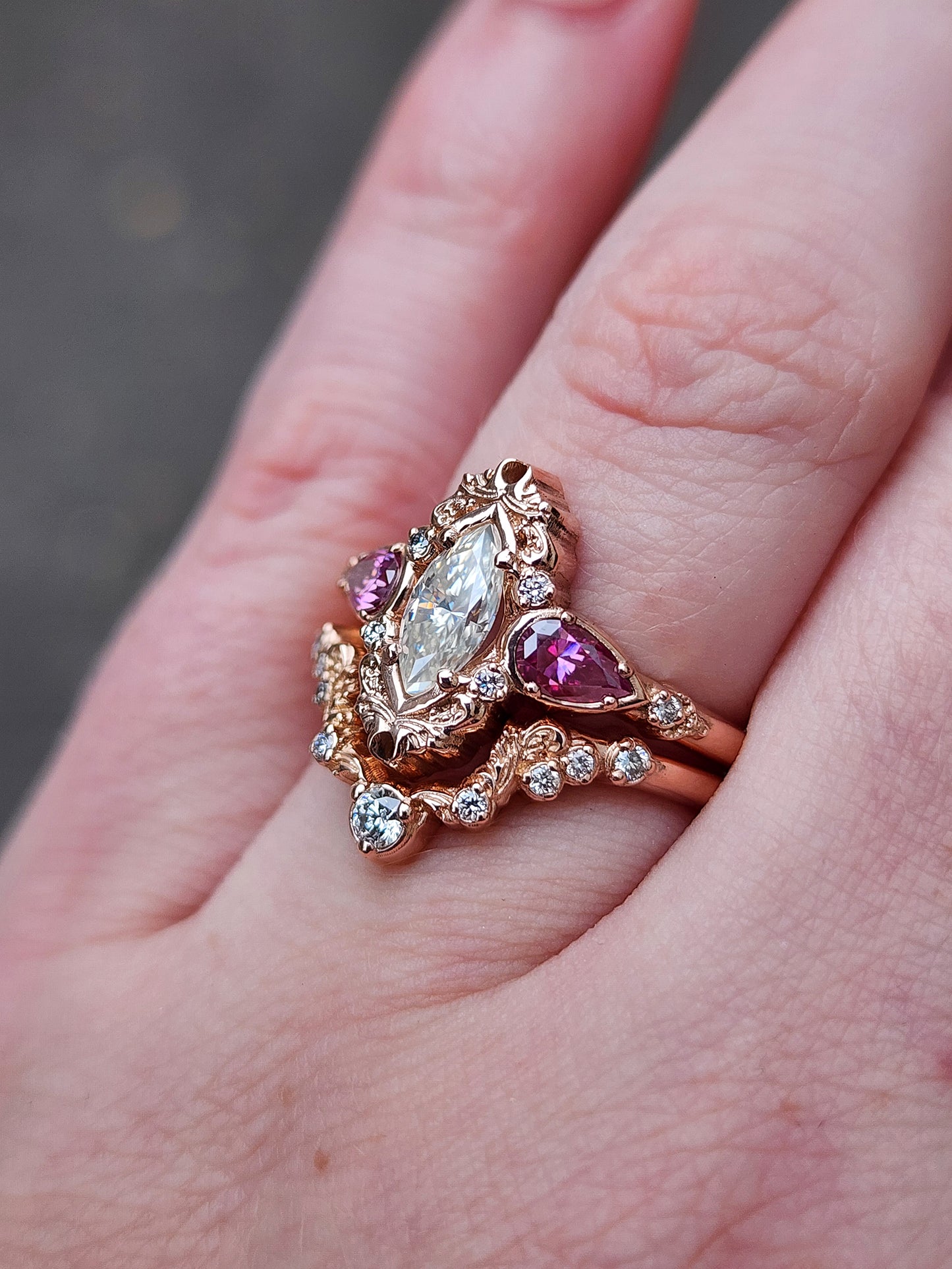 elvish marquise engagement ring with gold details and pink moissanite pears and curved diamond wedding band custom engagement ring set fantasy fairytale jewelry 