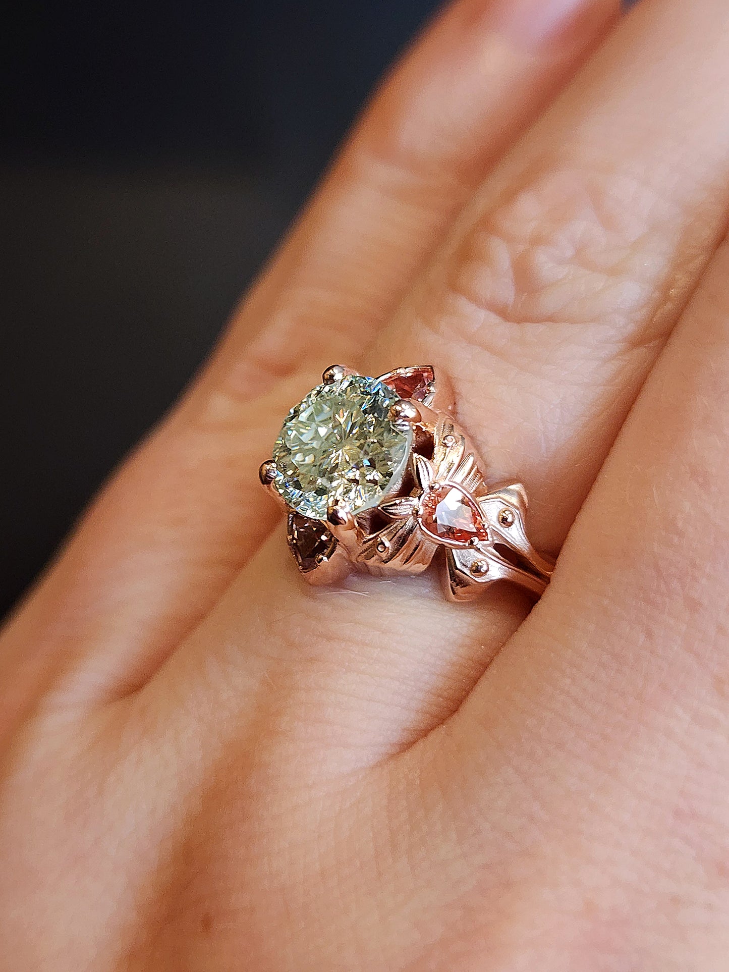 fantasy cut light green round moissanite engagement ring with champagne sapphire pears and trillions gold luna moths 14k fantasy jewelry