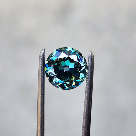 1.41ct old european cut teal moissanite round cut