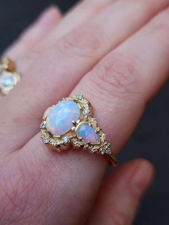 Lab Chatham Opal Ophelia anniversary ring with diamonds and gold scrolls 14k yellow gold