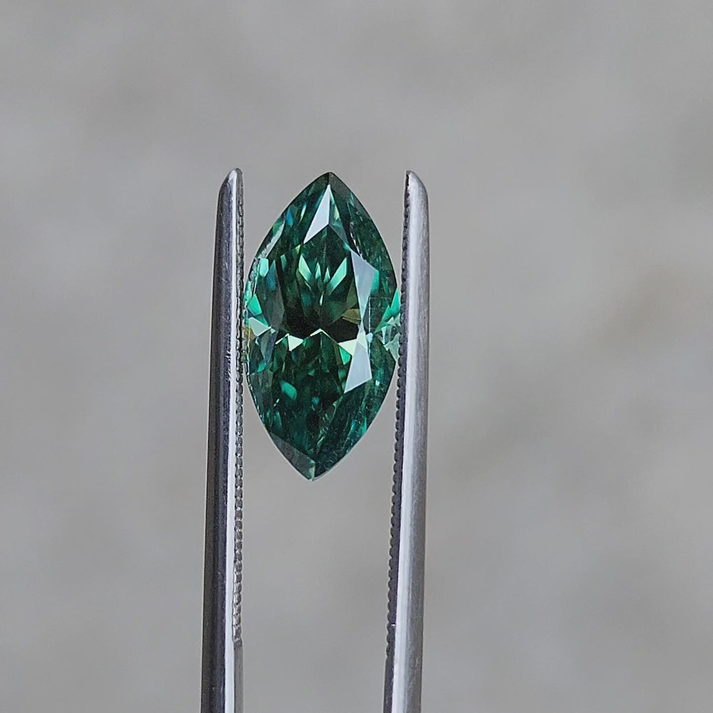 Load and play video in Gallery viewer, 2.04ct Deep Green Moissanite Marquise
