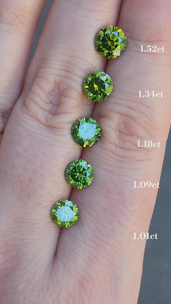 Load and play video in Gallery viewer, 1.01ct Irradiated Natural Green Round Brilliant Diamond
