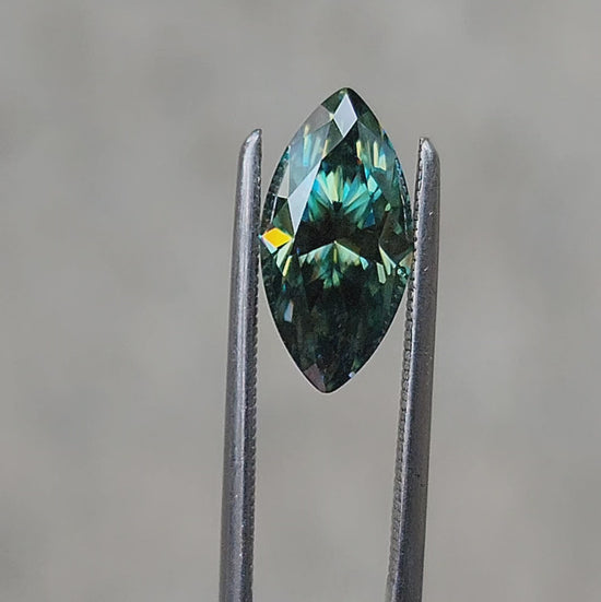 Load and play video in Gallery viewer, 1.73ct Deep Green Moissanite Marquise
