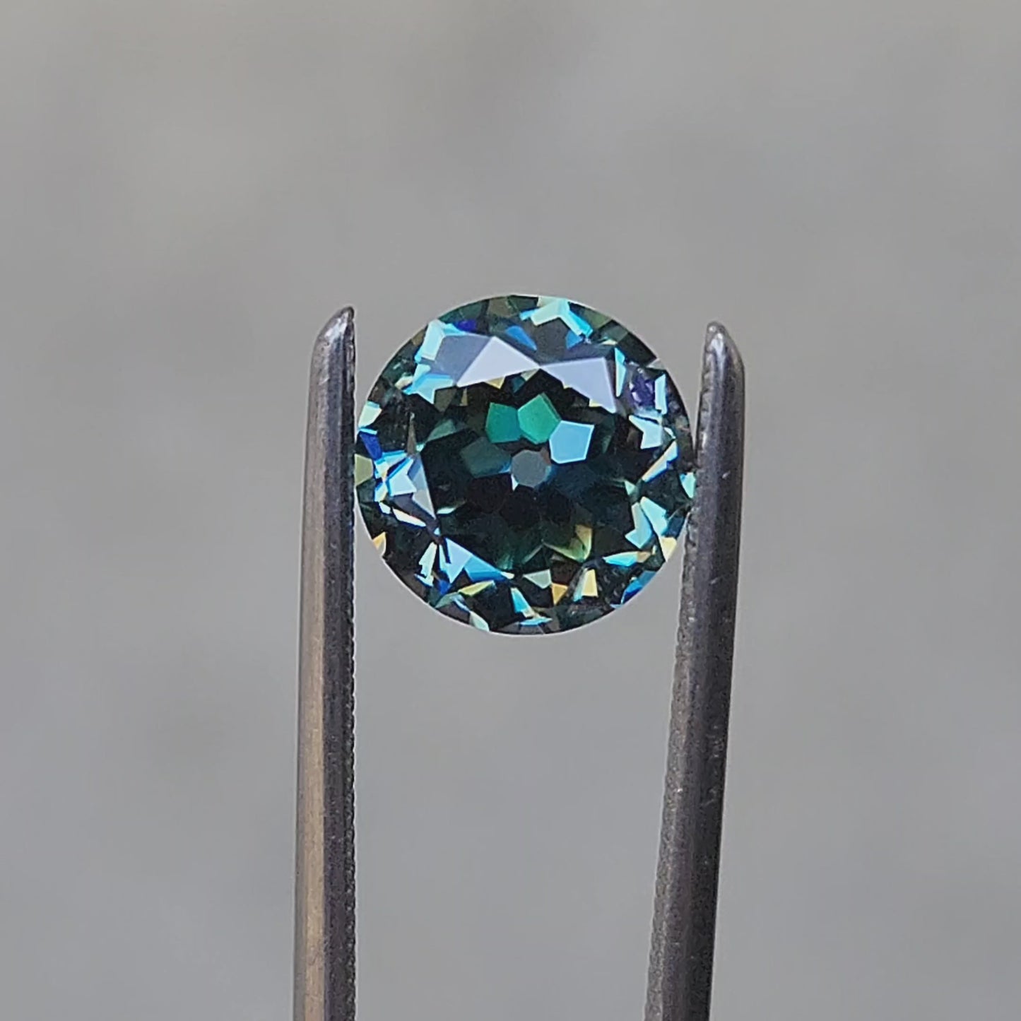 1.41ct old european cut teal moissanite round cut