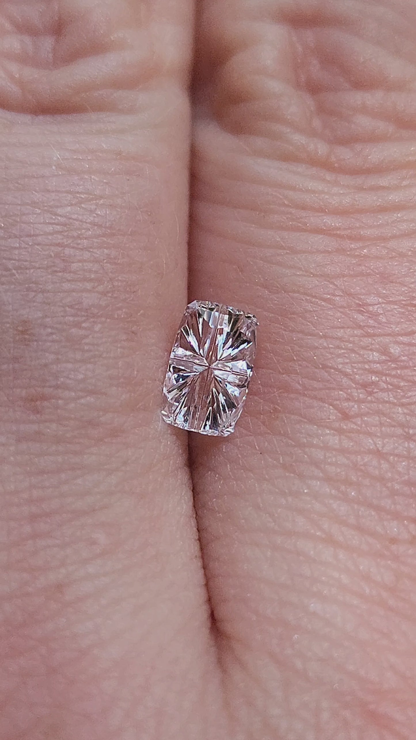 Load and play video in Gallery viewer, .72ct Natural White Sapphire Cushion - Star Brite Cut by John Dyer
