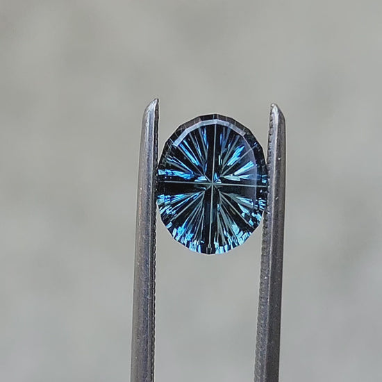 Load and play video in Gallery viewer, 1.26ct Natural Oval Parti Color Australian Sapphire - StarBrite Cut by John Dyer
