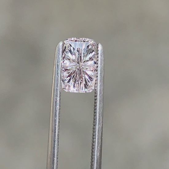 Load and play video in Gallery viewer, .72ct Natural White Sapphire Cushion - Star Brite Cut by John Dyer
