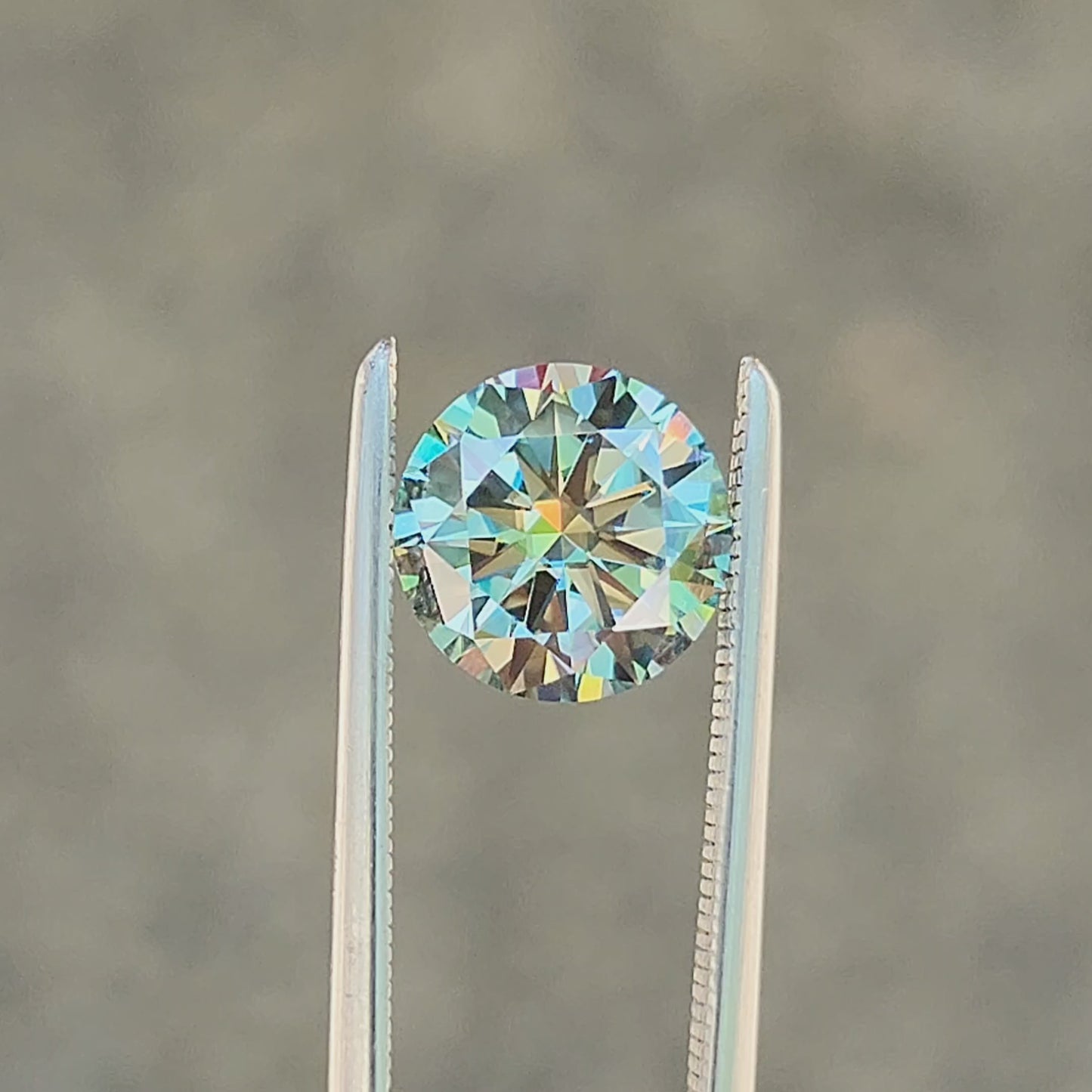 Load and play video in Gallery viewer, 1.48ct Round Teal Moissanite 7.5mm
